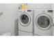 Laundry room featuring a front load washer and dryer at 6961 King Creek Dr, Sun City Center, FL 33573