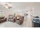 Bright living room featuring tile floors, ceiling fans, and an open floor plan at 6961 King Creek Dr, Sun City Center, FL 33573