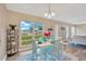 Bright dining room with a large window and view to the street at 704 Childers Loop, Brandon, FL 33511