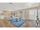 Inviting living room with new floors, large windows, and ample natural light at 704 Childers Loop, Brandon, FL 33511
