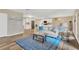 Open-concept living space seamlessly connecting the living room, kitchen, and dining area at 704 Childers Loop, Brandon, FL 33511