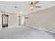 Large bedroom with neutral walls, carpet, walk-in closet and natural light at 704 Childers Loop, Brandon, FL 33511