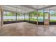 Covered patio overlooking a well-maintained backyard with privacy fence and landscaping at 704 Childers Loop, Brandon, FL 33511