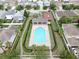 Community pool and basketball court from above with neighborhood in the background at 7611 Wood Violet Dr, Gibsonton, FL 33534