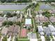 Aerial view showcasing community pool, basketball court, and lakes in neighborhood at 7611 Wood Violet Dr, Gibsonton, FL 33534