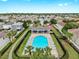 Aerial view of community pool, lounge, and basketball court within a neighborhood at 7611 Wood Violet Dr, Gibsonton, FL 33534