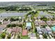 Aerial shot featuring community amenities like a pool, basketball court, and serene lakes at 7611 Wood Violet Dr, Gibsonton, FL 33534