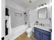 Modern bathroom with a tub, glass-enclosed shower, a vanity, and sleek fixtures for a relaxing ambiance at 7611 Wood Violet Dr, Gibsonton, FL 33534