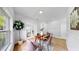Stylish dining area with a wooden table, modern chairs, and bright natural light at 7611 Wood Violet Dr, Gibsonton, FL 33534