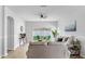 Bright living room with neutral color scheme and view of the backyard patio at 7611 Wood Violet Dr, Gibsonton, FL 33534