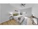 Bright and airy main bedroom featuring modern decor, a ceiling fan, and a comfortable queen size bed at 7611 Wood Violet Dr, Gibsonton, FL 33534