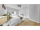 Bright and airy main bedroom featuring modern decor, a ceiling fan, and a comfortable queen size bed at 7611 Wood Violet Dr, Gibsonton, FL 33534