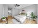 Bright and airy main bedroom featuring modern decor, a ceiling fan, and a comfortable queen size bed at 7611 Wood Violet Dr, Gibsonton, FL 33534