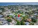 A home from an aerial view showcases its location in a peaceful neighborhood by a body of water at 7815 16Th Nw Ave, Bradenton, FL 34209