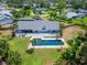 A captivating aerial view showcasing a home with a pool and a beautifully paved patio area at 7815 16Th Nw Ave, Bradenton, FL 34209