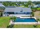 Aerial view showing a pool, patio, and landscaped backyard with a well-maintained lawn at 7815 16Th Nw Ave, Bradenton, FL 34209
