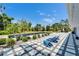 Inviting backyard featuring a pool, patio and lounge chairs under a clear blue sky at 7815 16Th Nw Ave, Bradenton, FL 34209