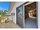 Balcony overlooking the room with fan, wood paneling, and desk at 7815 16Th Nw Ave, Bradenton, FL 34209