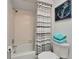 Cozy bathroom with a shower and bathtub combo, complemented by nautical-themed décor and fresh towels at 7815 16Th Nw Ave, Bradenton, FL 34209