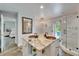Elegant bathroom displaying a double sink vanity with granite counters, plus access to a shower and the backyard at 7815 16Th Nw Ave, Bradenton, FL 34209