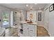 Modern bathroom showcasing double sinks with granite countertops, a glass enclosed shower, and outdoor access at 7815 16Th Nw Ave, Bradenton, FL 34209
