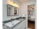 Contemporary bathroom vanity with a marble countertop and a view into the adjacent bedroom space at 7815 16Th Nw Ave, Bradenton, FL 34209