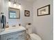 Bathroom featuring modern vanity with a large mirror, plus decor and lighting at 7815 16Th Nw Ave, Bradenton, FL 34209