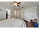 View of a bedroom with two closets, wood floors, and a doorway to a bathroom at 7815 16Th Nw Ave, Bradenton, FL 34209