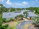 Charming home boasting manicured landscaping, a unique architectural design, and well maintained driveway at 7815 16Th Nw Ave, Bradenton, FL 34209