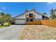 Charming two-story home with a front yard and a modern garage at 7815 16Th Nw Ave, Bradenton, FL 34209