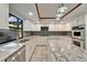 Spacious kitchen with stainless steel appliances, granite countertops, tile backsplash, and an island at 7815 16Th Nw Ave, Bradenton, FL 34209
