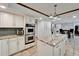 Modern kitchen featuring stainless steel appliances, granite countertops, and an island with barstool seating at 7815 16Th Nw Ave, Bradenton, FL 34209