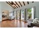Bright living room featuring hardwood floors, vaulted ceilings, and large windows with picturesque views at 7815 16Th Nw Ave, Bradenton, FL 34209