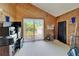 View of room with an exterior entrance featuring a sliding glass door and wood paneling at 7815 16Th Nw Ave, Bradenton, FL 34209