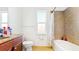 Bathroom featuring tile flooring, shower with bathtub, and window at 8111 Brickleton Woods Ave, Gibsonton, FL 33534