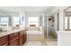 Elegant bathroom features a shower with glass enclosure and soaking tub at 8111 Brickleton Woods Ave, Gibsonton, FL 33534