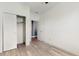 Secondary bedroom featuring closet, interior door and vinyl floors at 8111 Brickleton Woods Ave, Gibsonton, FL 33534