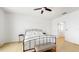 Neutral bedroom features a ceiling fan, white walls, and doorway at 8111 Brickleton Woods Ave, Gibsonton, FL 33534