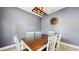 Cozy dining room featuring rustic wooden table and light fixture with gray paint at 8111 Brickleton Woods Ave, Gibsonton, FL 33534