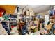 View of messy garage, but spacious enough for storage or vehicles at 8111 Brickleton Woods Ave, Gibsonton, FL 33534