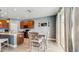 Eat-in kitchen with island, dining table, stainless appliances, and view to sliding glass door at 8111 Brickleton Woods Ave, Gibsonton, FL 33534