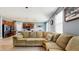 Spacious living room featuring an open floorplan, modern floors, and access to the kitchen at 8111 Brickleton Woods Ave, Gibsonton, FL 33534