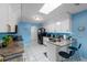 Stylish kitchen featuring modern white cabinets, granite countertops, and stainless steel appliances at 8216 Damara Dr, New Port Richey, FL 34653