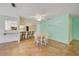 Cozy dining area adjacent to the kitchen with breakfast bar and ample seating at 8619 Gold Pine Dr, Port Richey, FL 34668