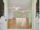 Bright and airy living room featuring tile flooring, ceiling fans, and large windows at 8619 Gold Pine Dr, Port Richey, FL 34668