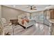 Comfortable bedroom featuring a ceiling fan, hardwood floors and neutral walls at 9136 Warm Springs Cir, Parrish, FL 34219