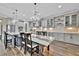 Spacious modern kitchen with pendant lighting, stainless appliances, countertops and ample storage at 9136 Warm Springs Cir, Parrish, FL 34219
