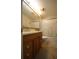 Bathroom featuring a tiled shower and modern single sink vanity with a granite-style top at 10402 Ashley Oaks Drive, Riverview, FL 33578