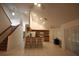 Open floor plan showcasing the kitchen with bar seating, bright lighting, and tile floors at 10402 Ashley Oaks Drive, Riverview, FL 33578