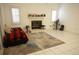 Open-concept living room with a fireplace, tile flooring, and natural light at 10402 Ashley Oaks Drive, Riverview, FL 33578